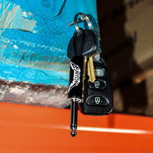Load image into Gallery viewer, Cliff Burton Logo Guitar Plug Keychain