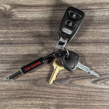 Load image into Gallery viewer, Ozzy Red Logo Guitar Plug Keychain